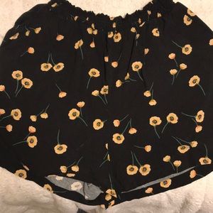 Black flowing shorts with a cinched waist band